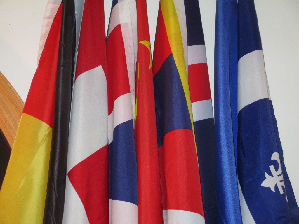 Le Mur des Drapeaux, or "the Wall of the Flags", includes the flags of (L-R) Germany, Belgium, Switzerland, the United Kingdom, the Soviet Union, Tibet, recently-added Iceland, France, and Québec. The LGBTQ Pride and Maryland flags have been removed by the Sôgmô and currently hang in the Sôgmô's residence on the University of Maryland campus.